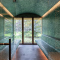 Jade 25mm Square green glass mosaic in a sauna with built-in benches