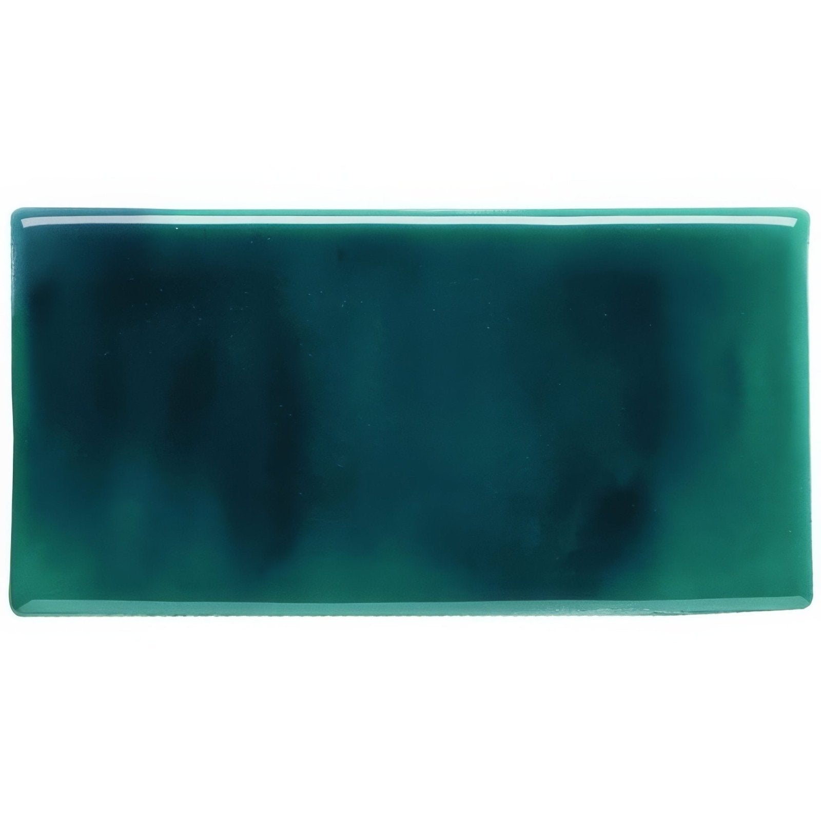 A rectangular jade half tile made of glossy teal ceramic with a smooth slightly translucent surface and darker marbling