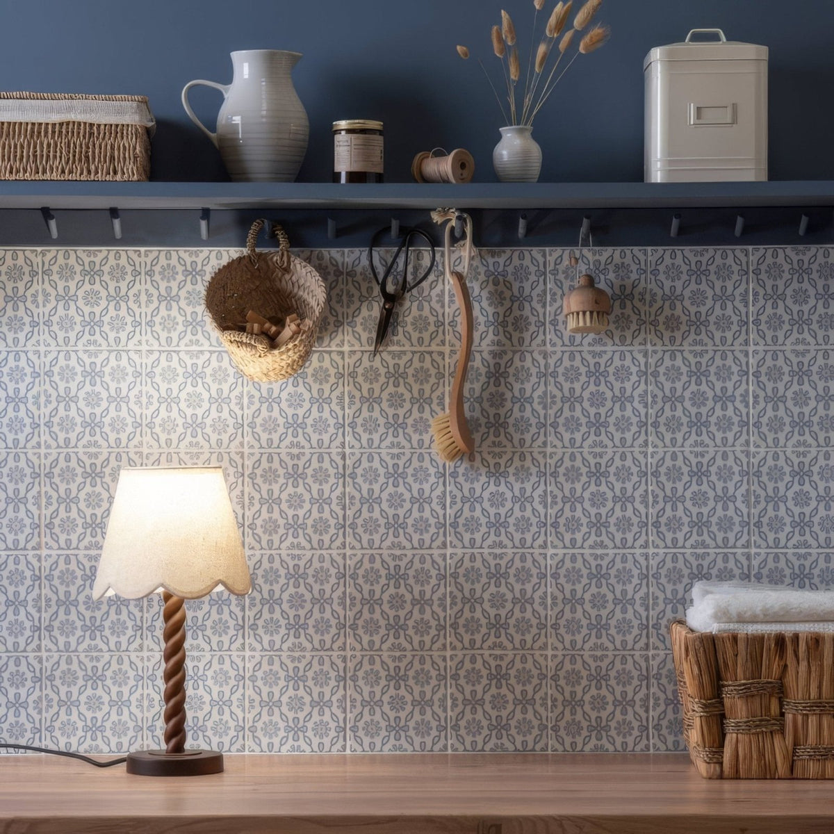 Jaipur Daisy table lamp with a twisted wooden base and a scalloped off-white fabric shade in warm tones