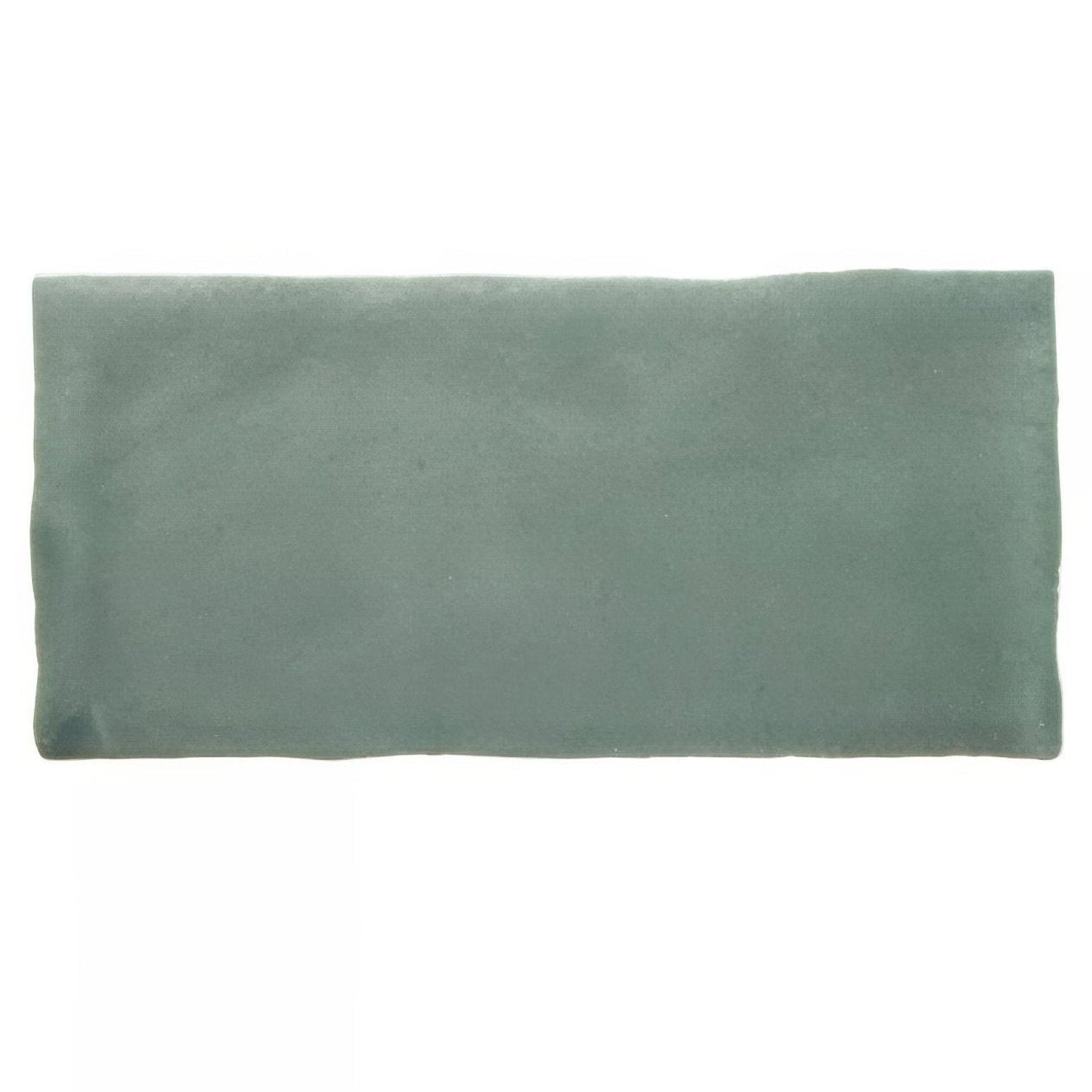 A rectangular matte-finished teal ceramic glazed tile with slightly uneven edges from jaipur dartmouth green collection