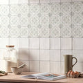 White ceramic tiles jaipur jasmine with subtle gray geometric patterns arranged in a grid for wall decor