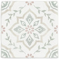 A square ceramic tile named Jaipur Jasmine with a delicate symmetrical floral pattern in soft gray and blush pink tones