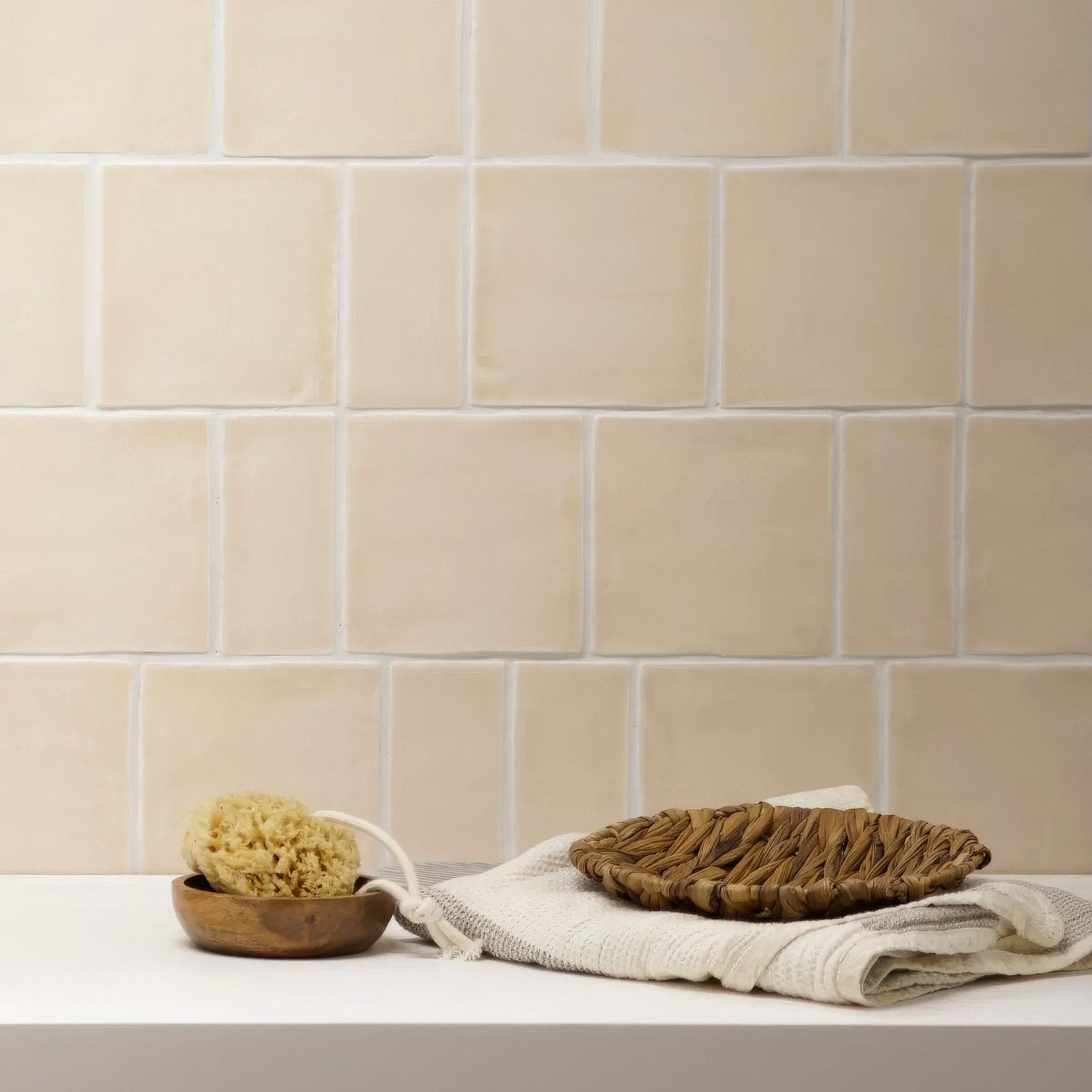 Beige ceramic subway tile with subtle texture and white grout from jaipur old ochre rectangle glazed tile collection