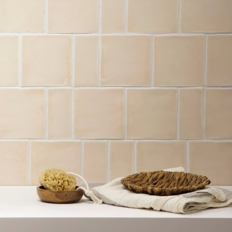 Beige ceramic jaipur old ochre square glazed subway tile with subtle texture and white grout for wall use