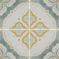 Jaipur sikkar patterned tile featuring a decorative ceramic surface with gold and gray quatrefoil design on off-white background