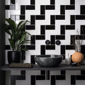 Black marble basin set against a Jet Black Half Tile wall