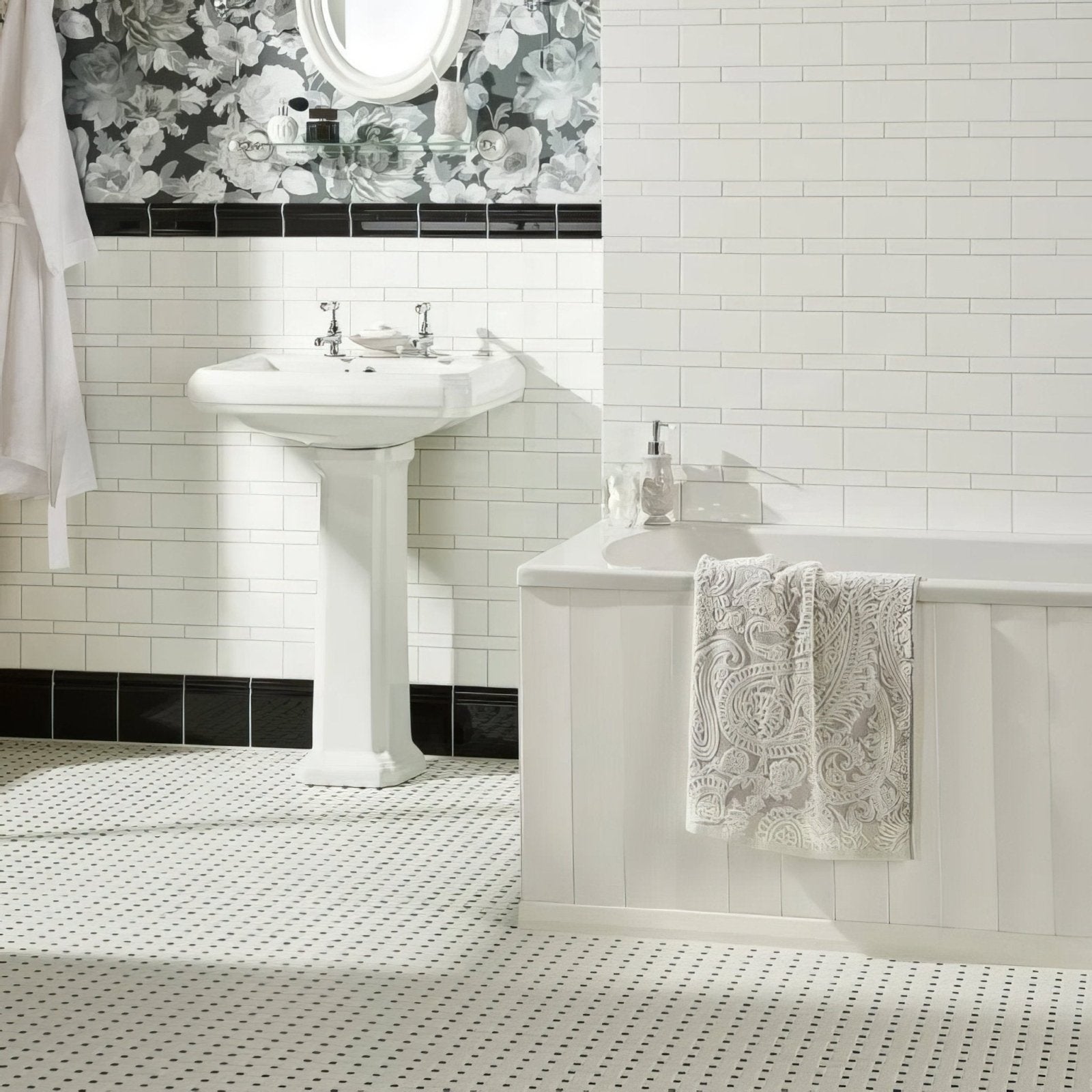 White pedestal sink with chrome faucets featuring jet black victoria moulding for stylish bathroom decor