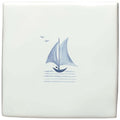 White ceramic tile featuring a hand-painted blue sailboat and two seagulls above stylized water lines by jim howard of fowey delft boat