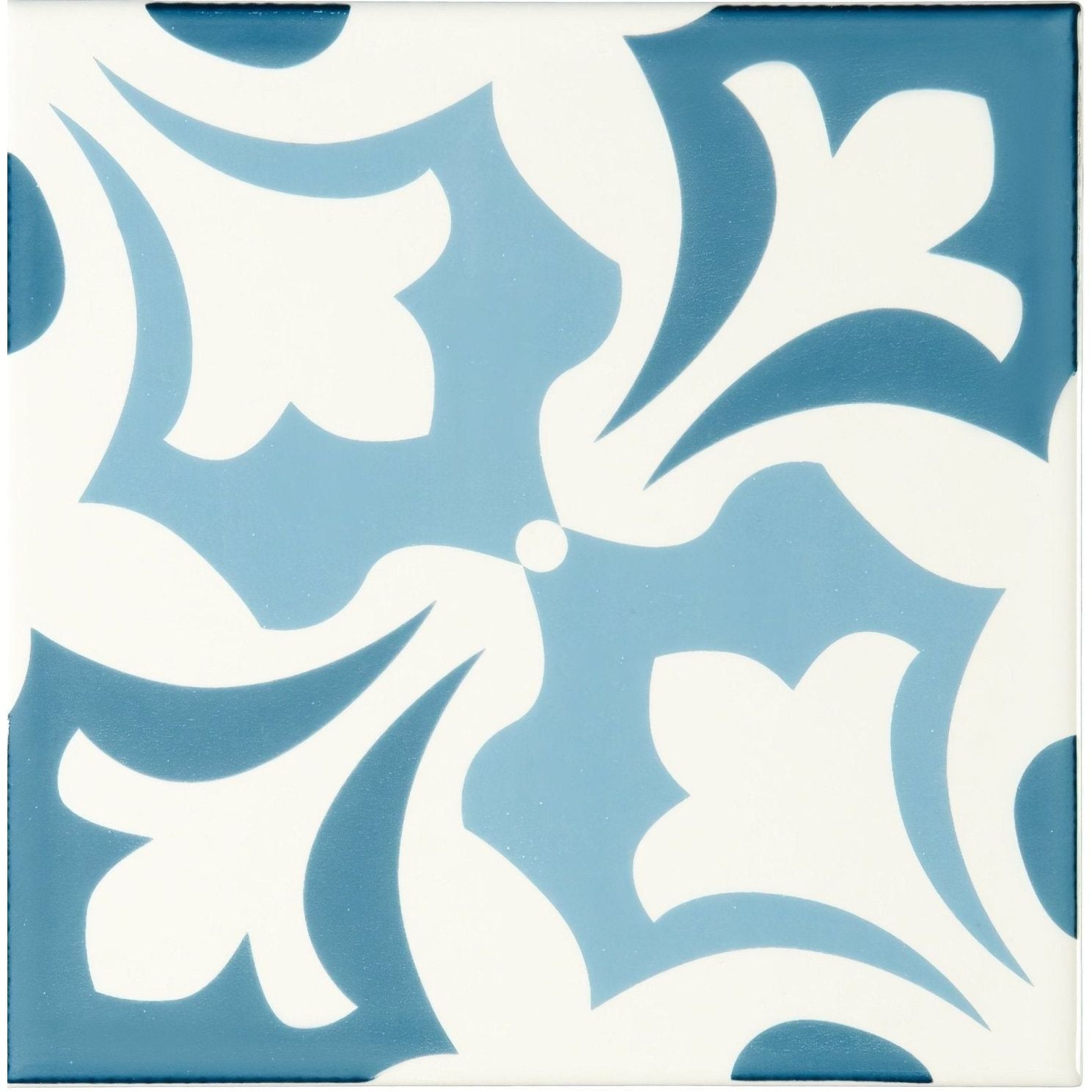 Blue and white ceramic tile with an ornate symmetrical floral pattern from the josette blue on brilliant white collection