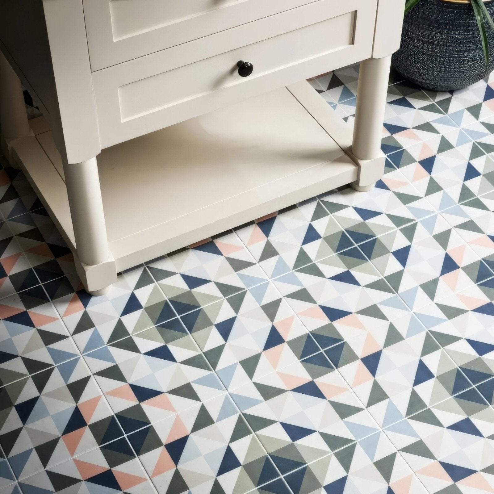 Kaleidoscope porcelain skipper floor tiles with geometric pattern in navy gray blush pink and white colors