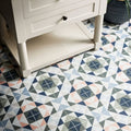 Kaleidoscope porcelain skipper floor tiles with geometric pattern in navy gray blush pink and white colors