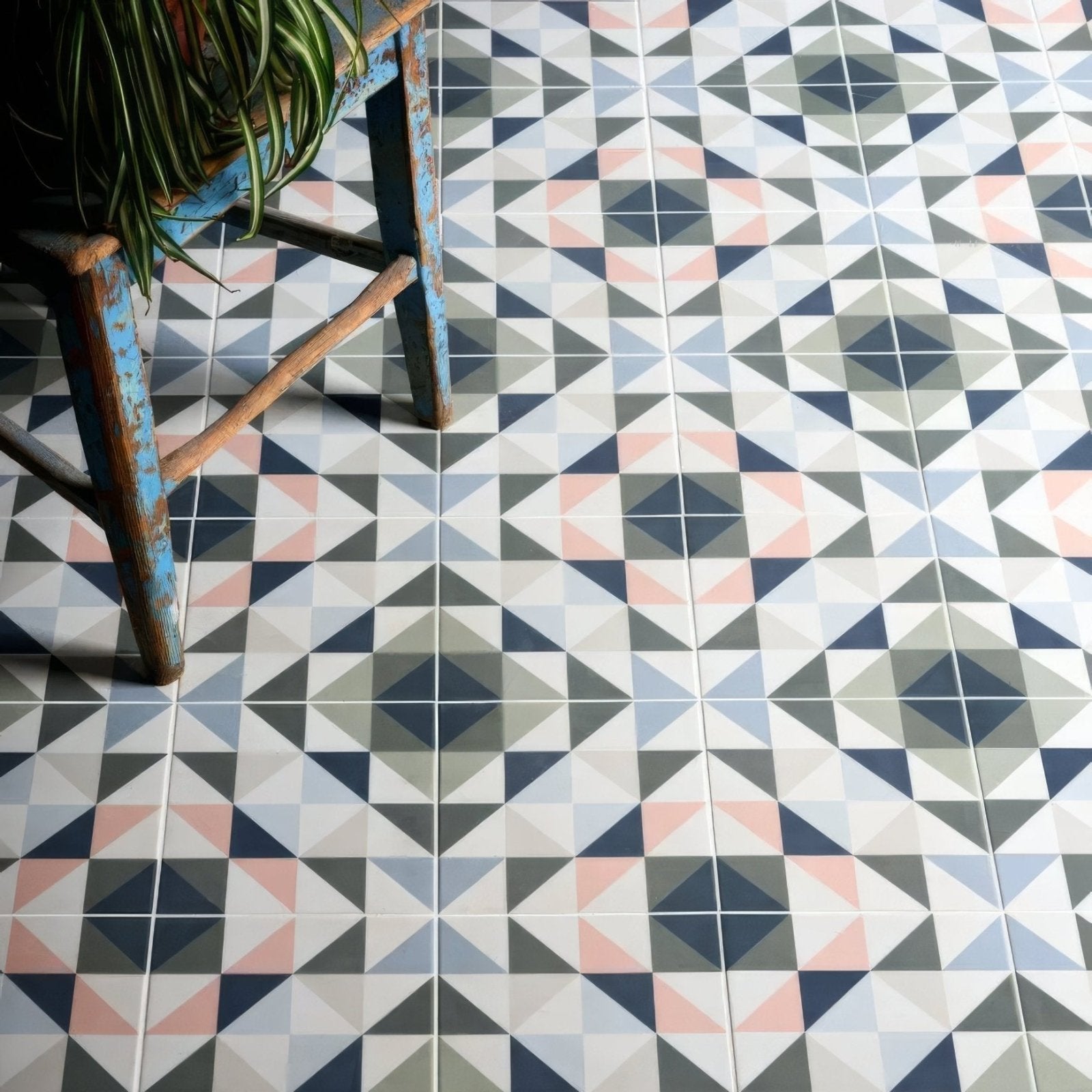 Kaleidoscope porcelain skipper floor tiles with navy blush pink gray and white geometric triangle pattern