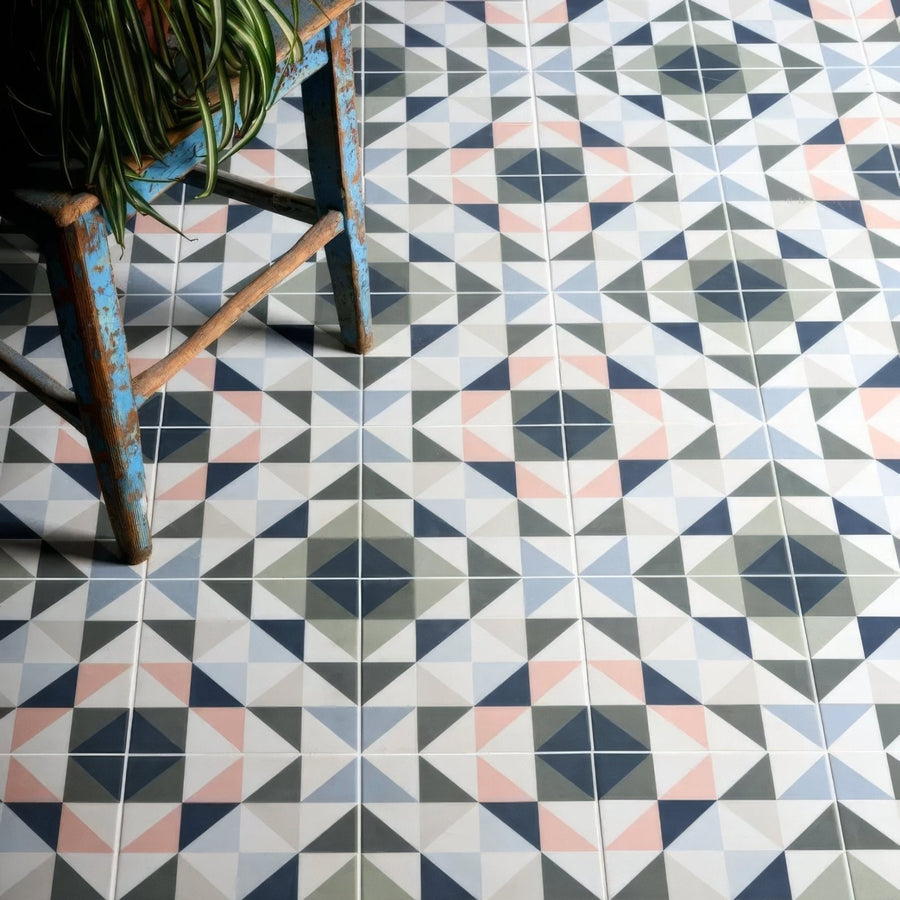 Kaleidoscope porcelain skipper floor tiles with navy blush pink gray and white geometric triangle pattern