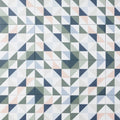 Geometric patterned kaleidoscope porcelain skipper tile with interlocking triangles in white gray navy blue and peach tones