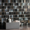 Kamino Rectangle Mix Mosaics black and silver glass mosaic with a grey soap dispenser in a tray