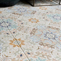 Patterned kashmir porcelain pastel ceramic floor tiles with intricate floral and geometric designs in muted pastel tones