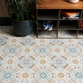 Patterned ceramic porcelain floor tiles with vintage floral design in muted blue green and beige tones for Kashmir Porcelain Pastel