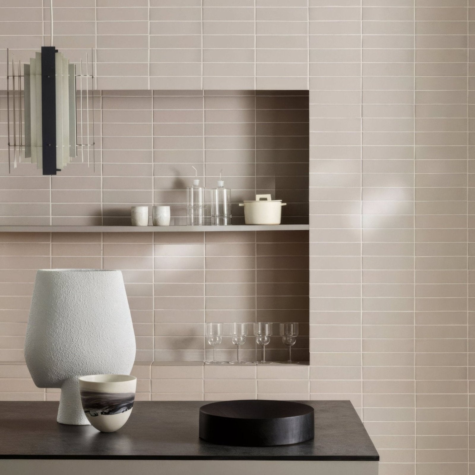 A matte-finished light gray ceramic vase with a textured surface and tapered shape from kelly hoppen perfect neutrals taupe