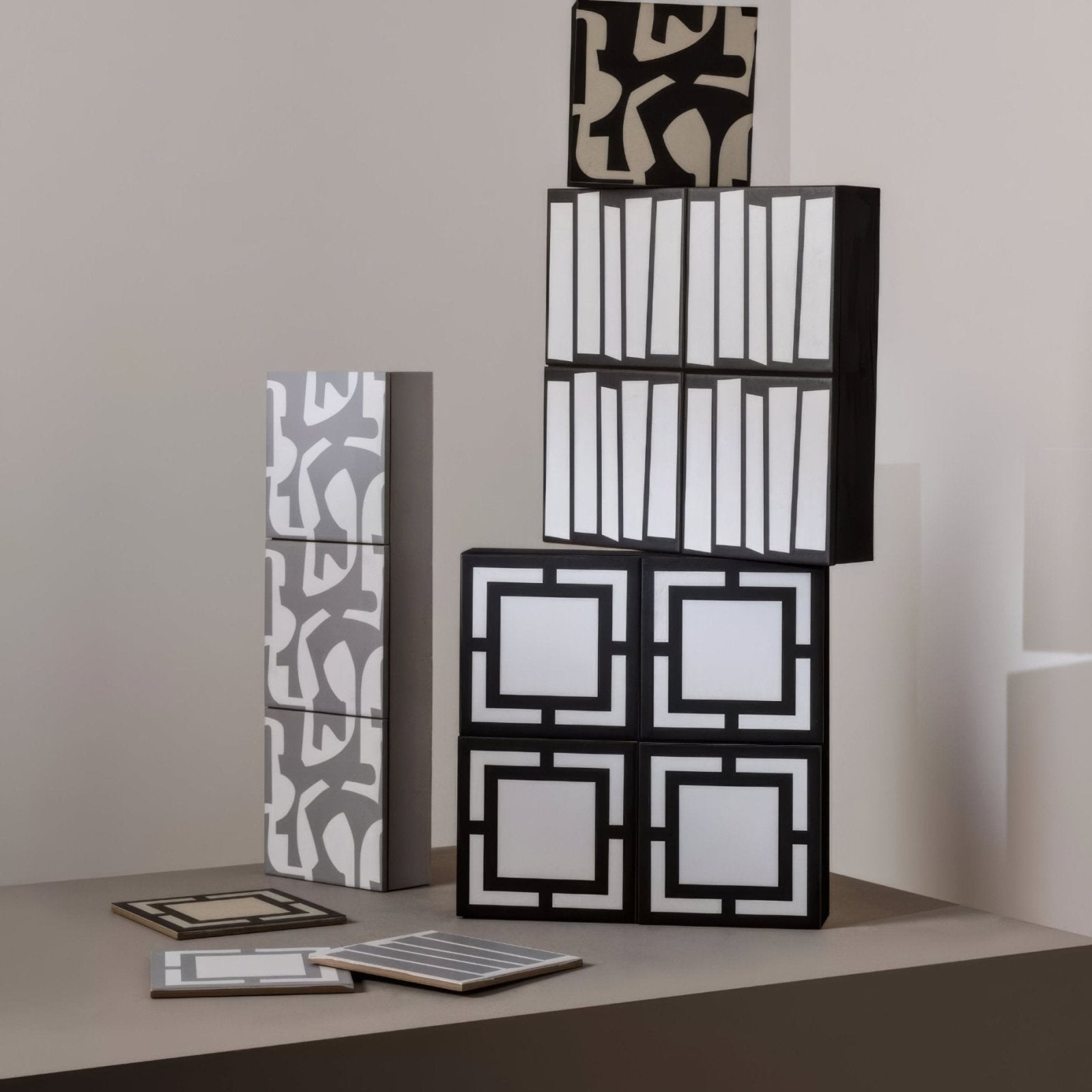 Kelly Hoppen signature black and white modular storage cubes with geometric pattern and modern minimalist design