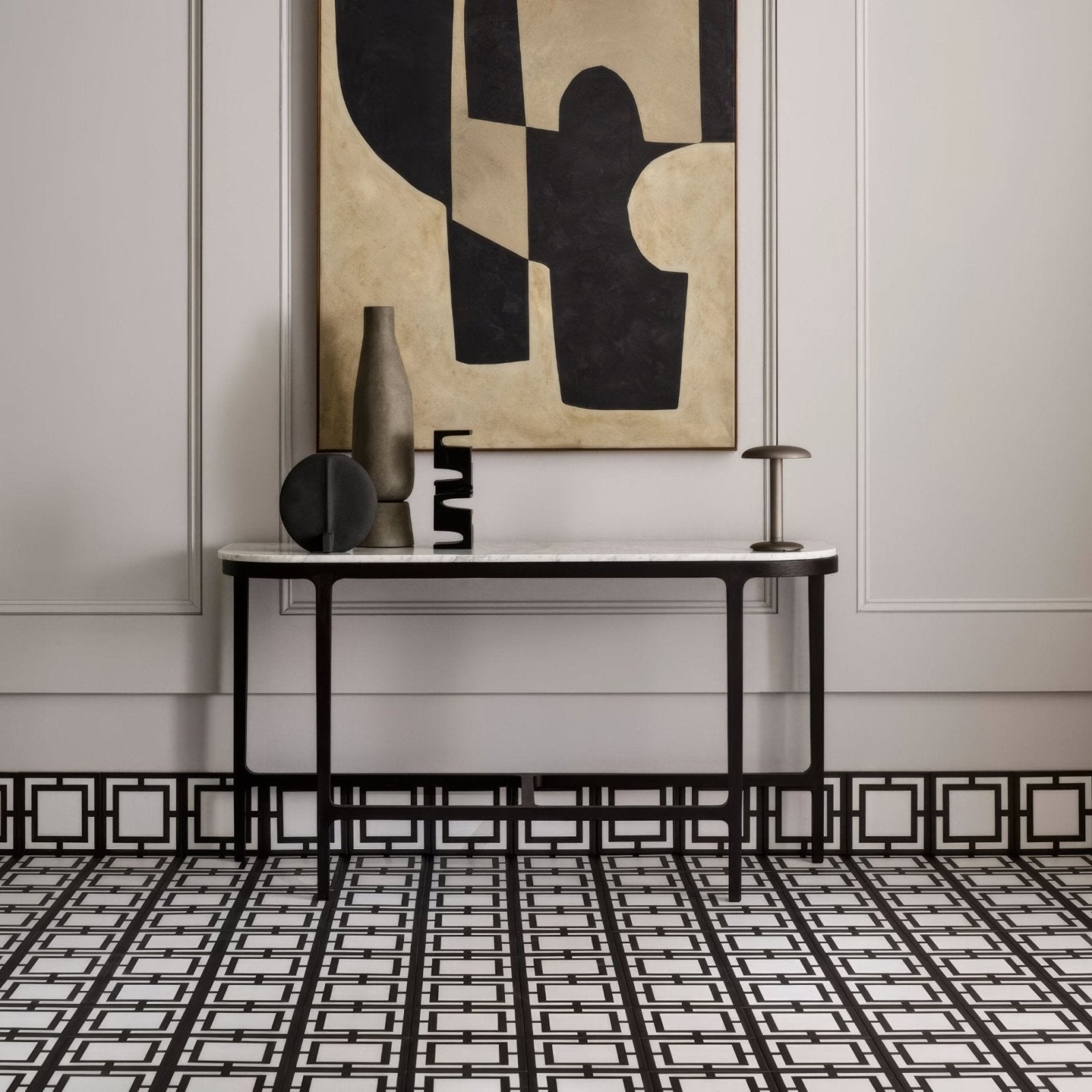 Black metal console table with white marble top from kelly hoppen signature black and white collection