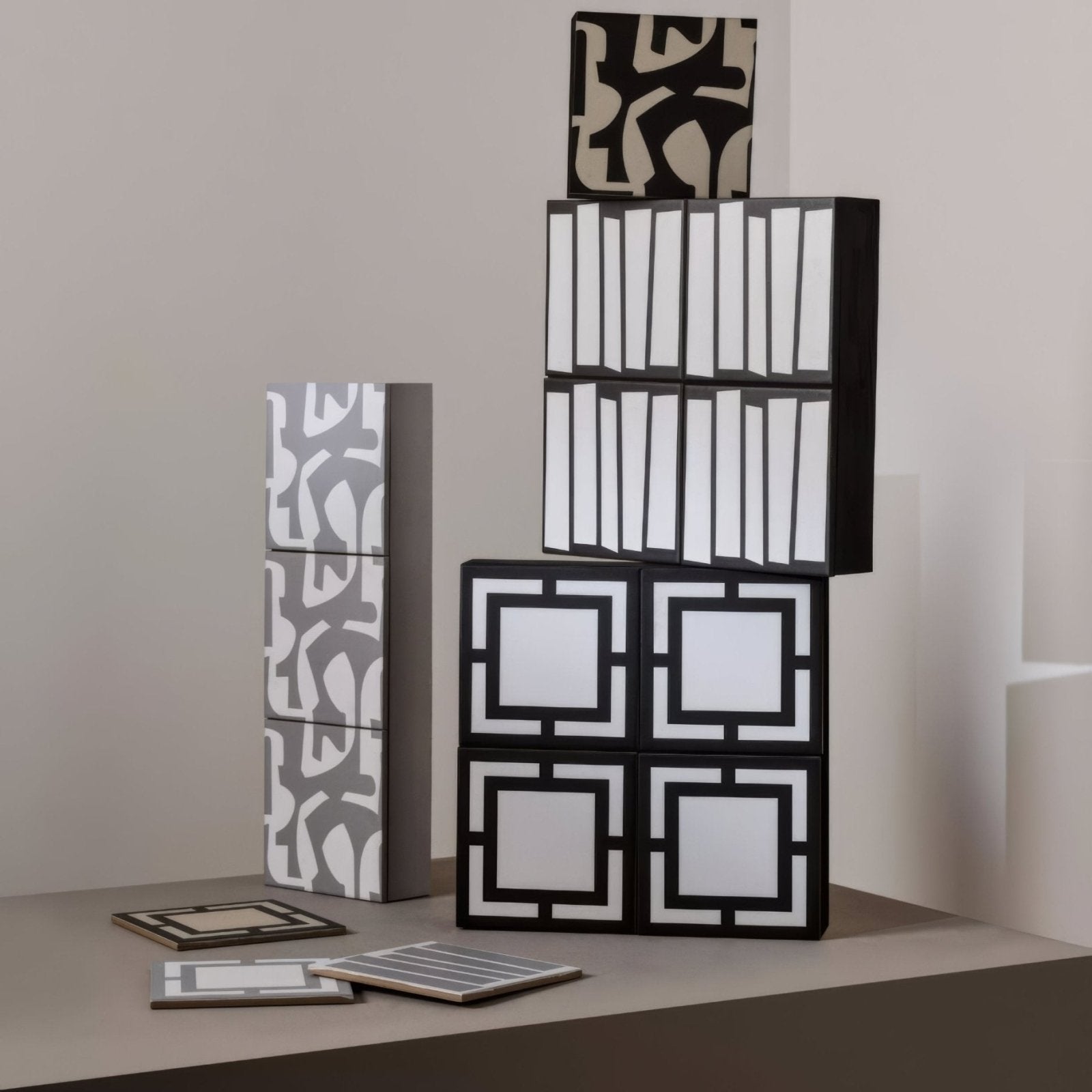 Black and white geometric-patterned modular storage cubes by Kelly Hoppen with a modern minimalist design