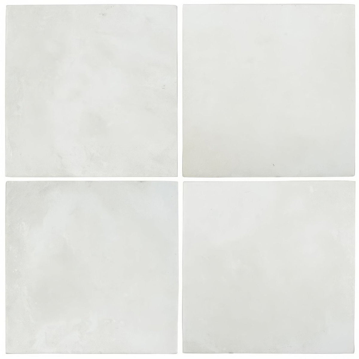 Four kelmscott antique white ceramic tiles with subtle gray veining arranged in a square grid pattern