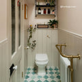 White ceramic toilet from Kelmscott White Tile with sleek modern design and smooth rounded edges