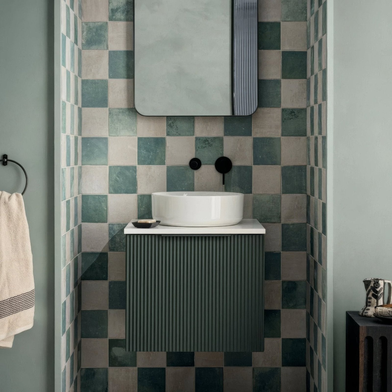 Kelmscott white tile white ceramic vessel sink with sleek modern design on dark green ribbed vanity cabinet