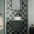 Kelmscott white tile white ceramic vessel sink with sleek modern design on dark green ribbed vanity cabinet