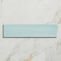 A sleek rectangular mint green glass tile with a subtle glossy finish from kennet porcelain aqua collection