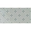A rectangular ceramic tile kew on sudbury with muted sage green glaze and light gray starburst pattern