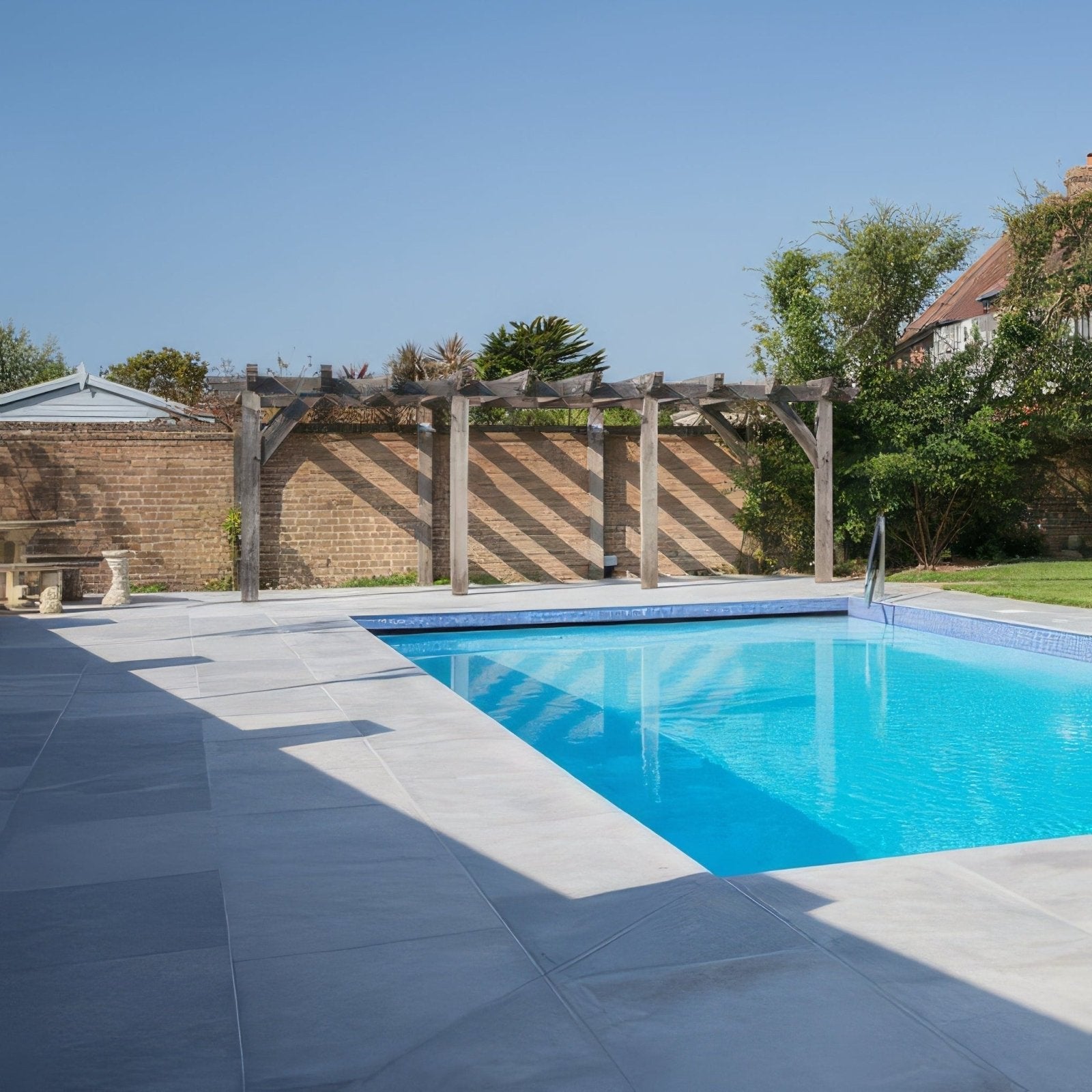 Kimmeridge Limestone Paving Etched Finish grey limestone paving around a pool