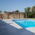 Kimmeridge Limestone Paving Etched Finish grey limestone paving around a pool