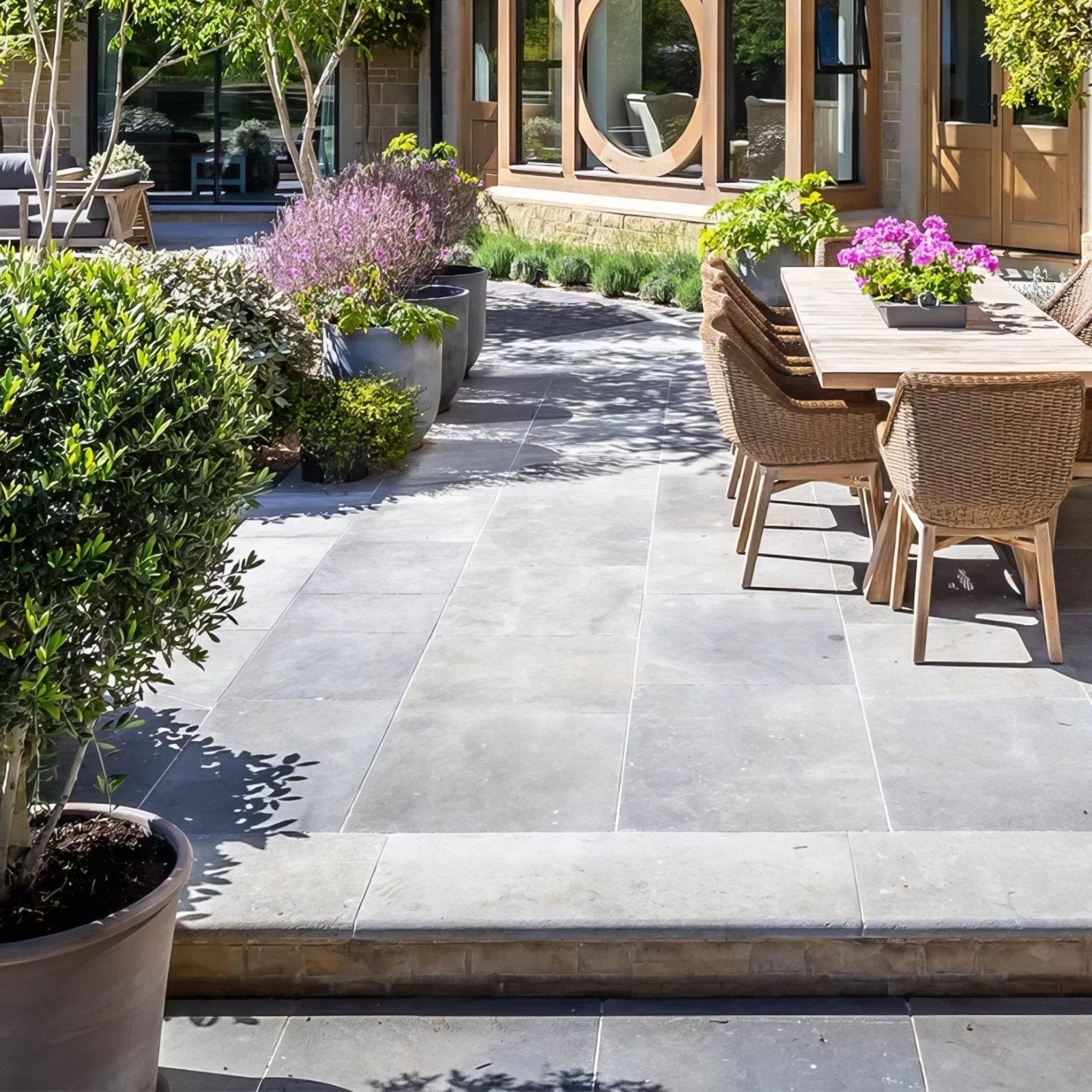 Gray stone patio tiles with subtle texture and natural tone variations kimmeridge limestone tumbled and etched finish