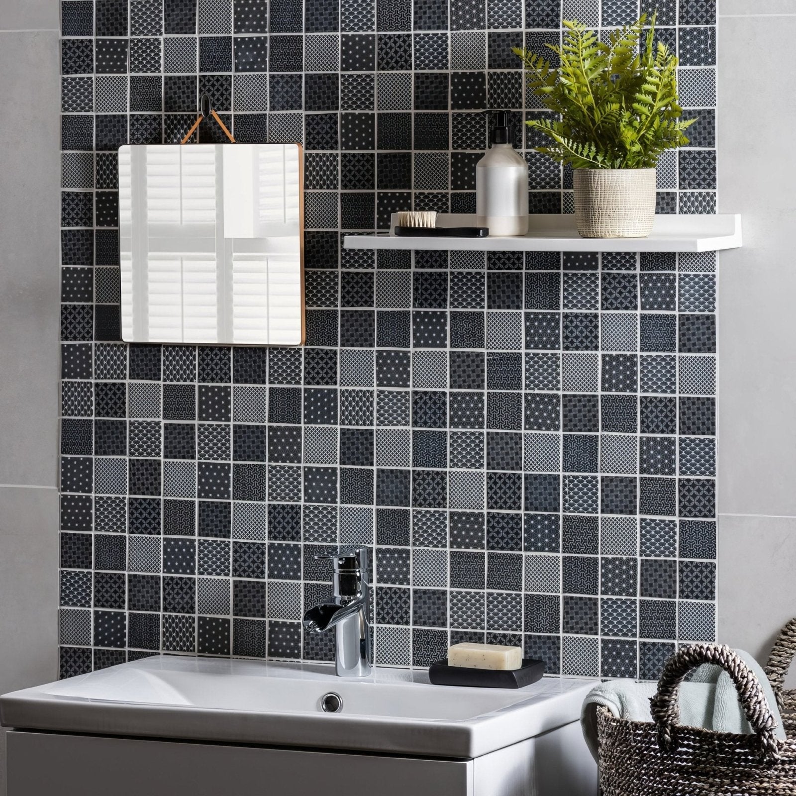 White rectangular mirror with wooden frame hanging on black and gray patterned tiled wall kinetic black recycled glass