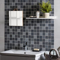 Kinetic Black Recycled Glass black and white patterned glass mosaic with a wooden-framed mirror