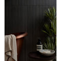 Dark vertical-striped ebony porcelain wall panel from kinfolk with a sleek modern design for interior use