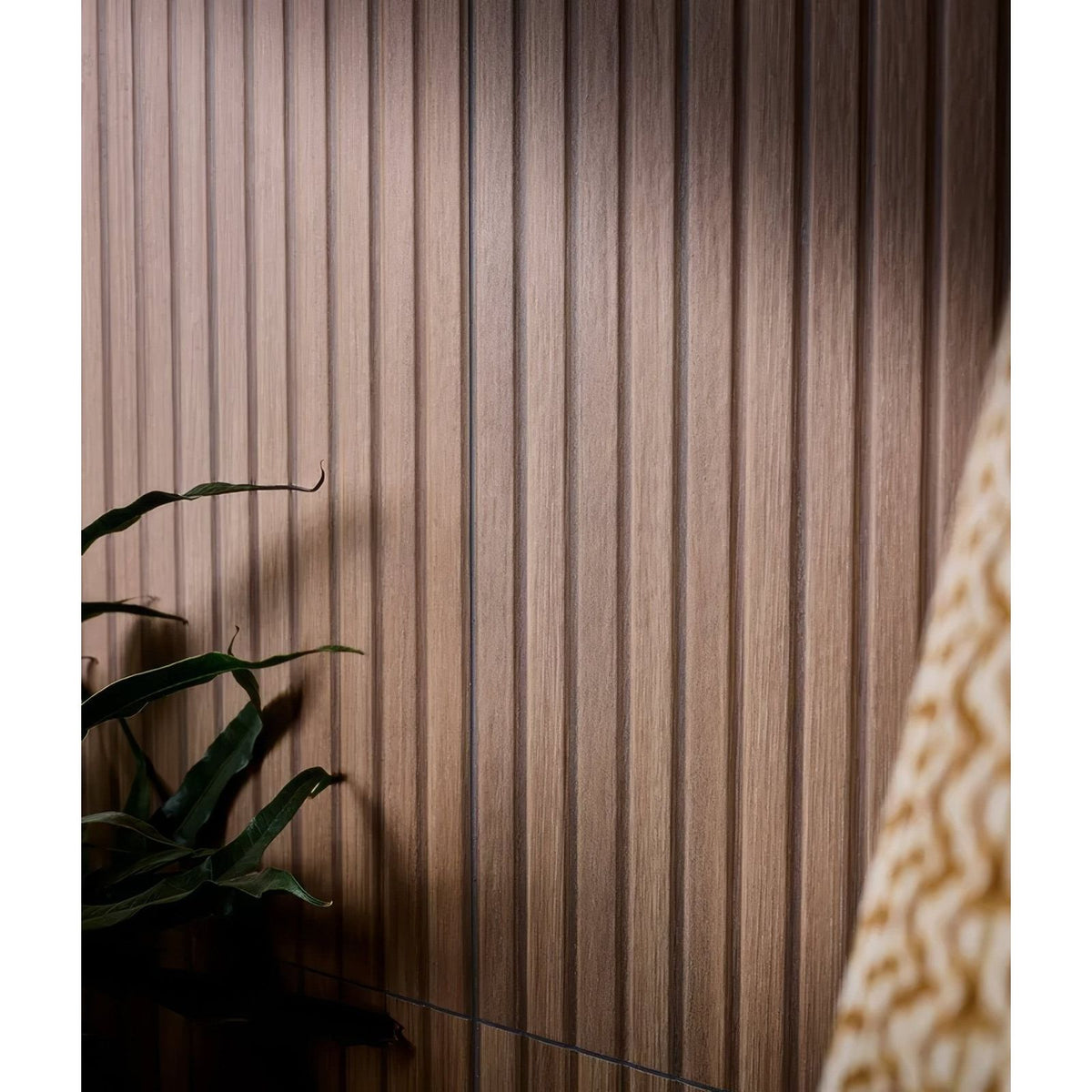 Warm-toned vertical wood paneling with subtle grain texture on kinfolk porcelain nut wall panel design