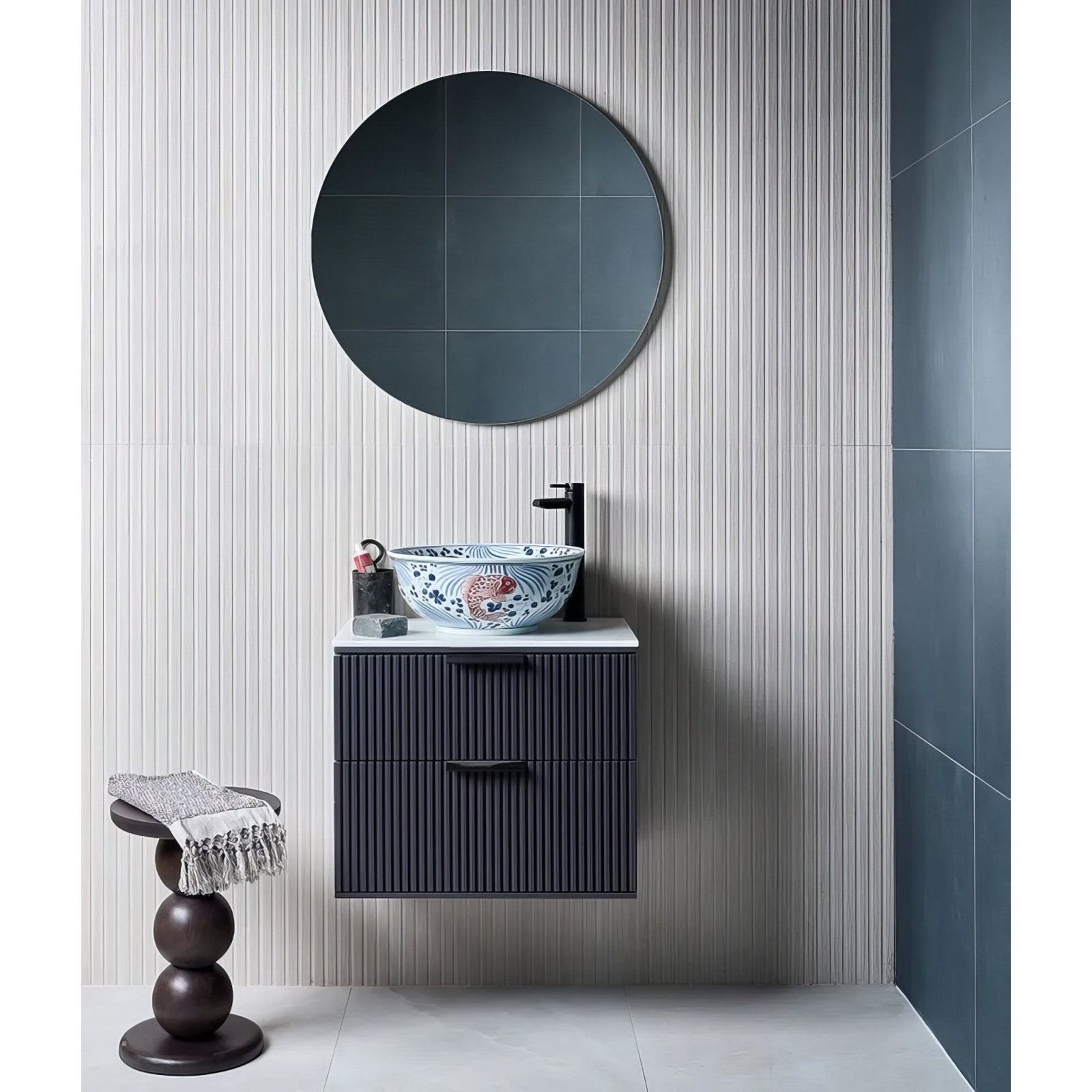 A blue and white kinfolk porcelain white ceramic vessel sink with intricate floral patterns for bathroom use
