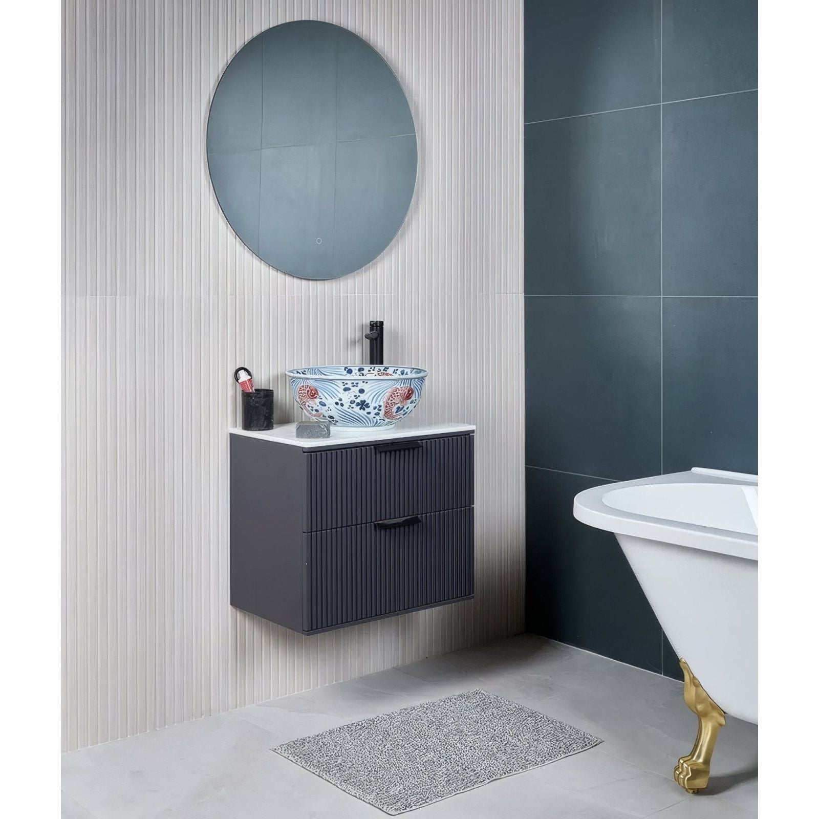 Kinfolk porcelain white blue and white floral ceramic vessel sink with black faucet on dark gray striped vanity cabinet