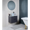 Kinfolk Porcelain White white wood-effect porcelain tiles with a floral vessel sink and grey vanity