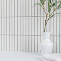 Kitkat White Mosaic white ceramic mosaic with a white vase holding a green branch