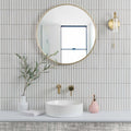 Kitkat White Mosaic white ceramic mosaic with a round gold-framed mirror above a sink