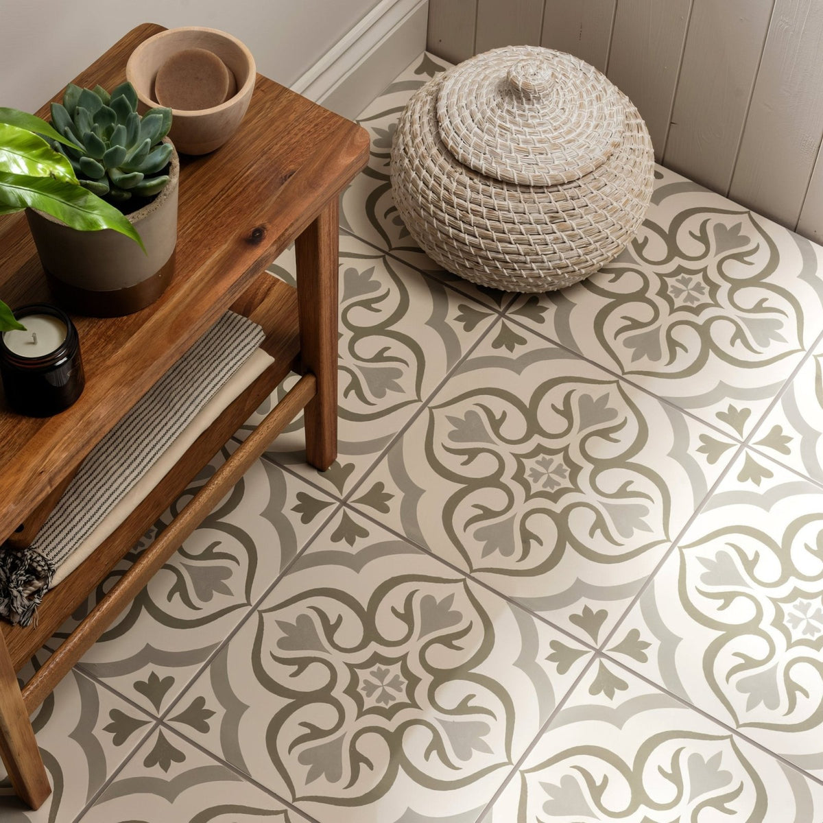 Beige woven basket with matching lid and intricate braided pattern from the Knightshayes Green on Chalk collection