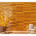 Golden glossy rectangular ceramic tiles in a horizontal pattern forming a wall from koeda mustard crackle collection