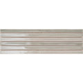 Six koeda xl camaleon ceramic tiles with a matte light gray finish and subtle copper-toned edges arranged in rows