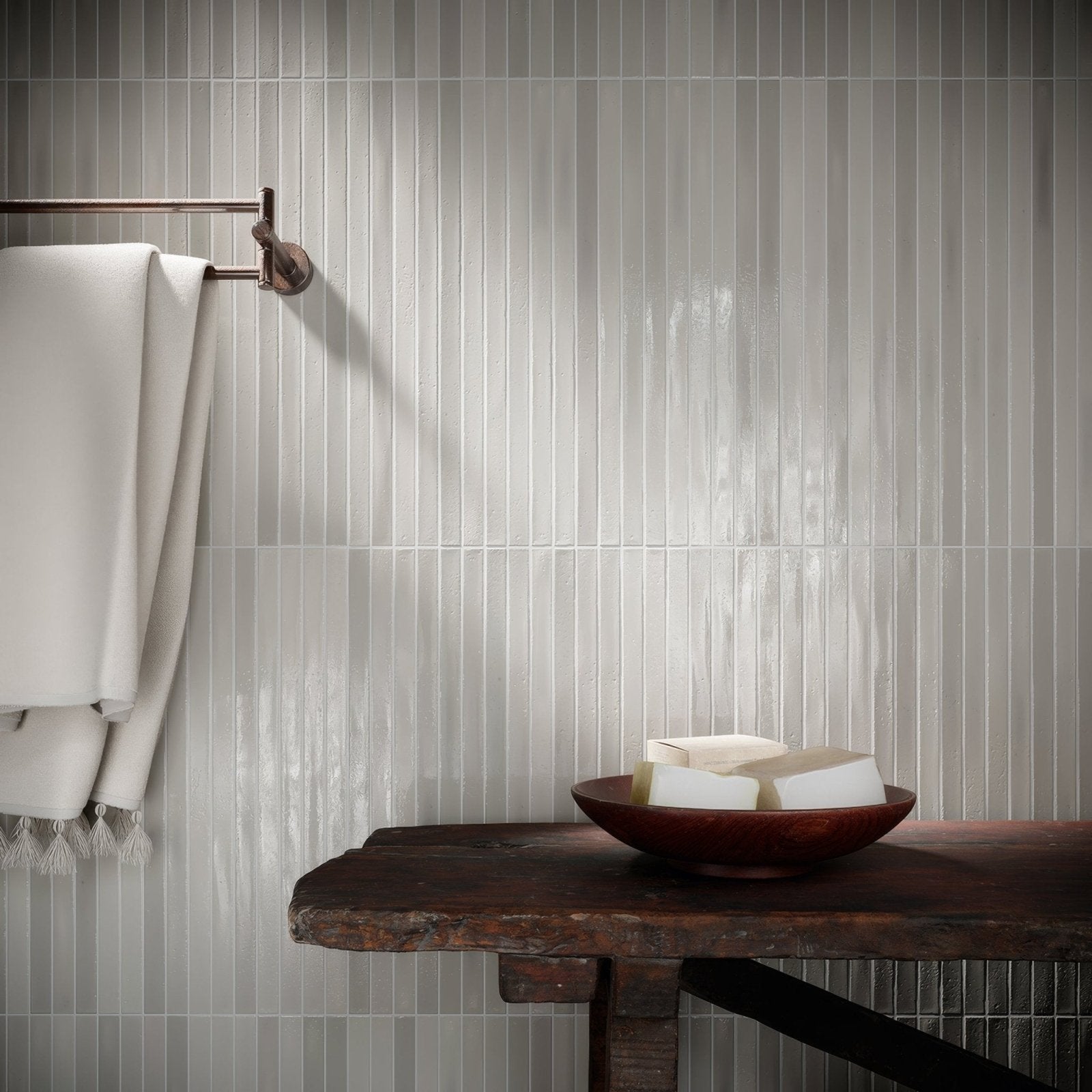 Koeda XL Metropolitan grey ceramic mosaic with a rustic dark wooden table