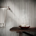 Koeda XL Metropolitan grey ceramic mosaic with a rustic dark wooden table