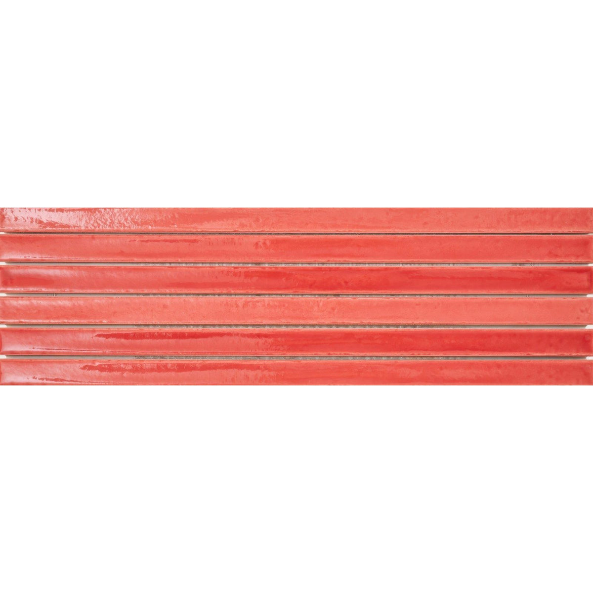 
Coral-colored glossy ceramic tile strip koeda xl wilde coralito with a subtle textured surface