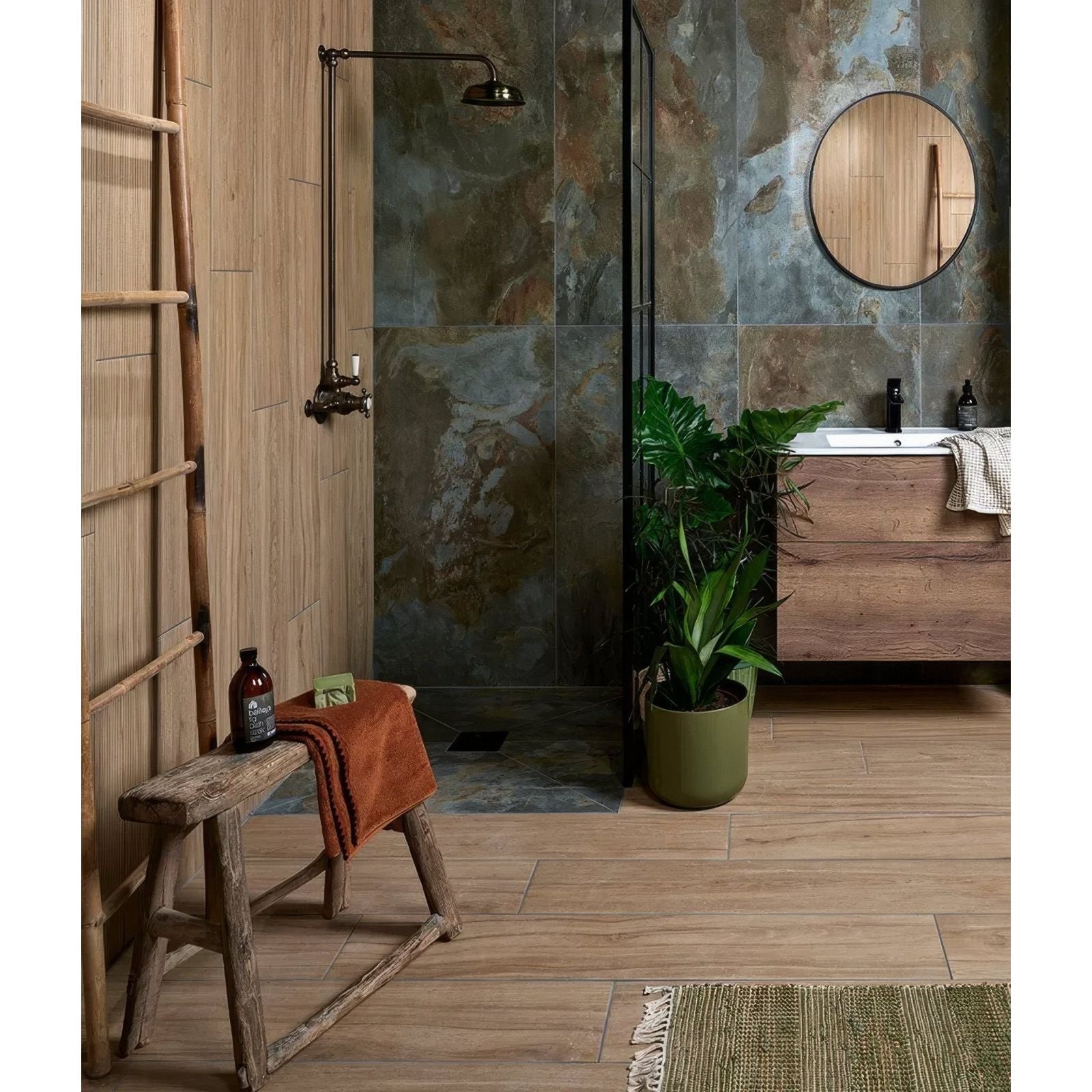 Rustic wooden stool with weathered finish and orange towel draped over it in komodo porcelain green setting